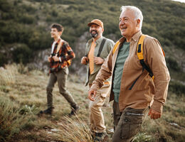 Three generations of men hiking together